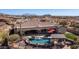 Estate with a backyard oasis, showcasing a pool, spa, outdoor kitchen, and lush landscaping at 2330 N Channing --, Mesa, AZ 85207
