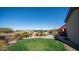 Lush backyard with green grass and a sparkling pool provides space for outdoor enjoyment at 2330 N Channing --, Mesa, AZ 85207