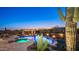 Backyard pool with spa, fire features, outdoor kitchen, and desert landscaping, perfect for entertaining at 2330 N Channing --, Mesa, AZ 85207