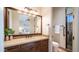 Bathroom featuring a shower, toilet, and vanity with dark wood cabinets and a granite countertop at 2330 N Channing --, Mesa, AZ 85207