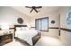 Bright bedroom featuring a ceiling fan, carpet floors, and a window with wooden trim at 2330 N Channing --, Mesa, AZ 85207