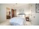 Cozy bedroom with a queen bed, ensuite bathroom, and a walk-in closet at 2330 N Channing --, Mesa, AZ 85207