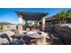 Inviting outdoor fire pit with seating, perfect for cool evenings at 2330 N Channing --, Mesa, AZ 85207