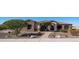 Beautiful home featuring well-manicured landscaping, a stone facade, and a paver walkway at 2330 N Channing --, Mesa, AZ 85207