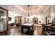 Luxurious game room with a pool table, chandelier, and seamless access to a wine cellar at 2330 N Channing --, Mesa, AZ 85207