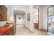 Hallway with decorative furnishings leading to a full bathroom and bedroom at 2330 N Channing --, Mesa, AZ 85207