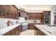 Gourmet kitchen boasts custom cabinetry, stainless steel appliances, granite countertops and tile backsplash at 2330 N Channing --, Mesa, AZ 85207