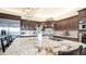 Gourmet kitchen island boasts custom cabinetry, stainless steel appliances, granite countertops and tile backsplash at 2330 N Channing --, Mesa, AZ 85207