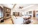 Spacious living area featuring a stone fireplace, comfortable seating, and a seamless transition to other living spaces at 2330 N Channing --, Mesa, AZ 85207