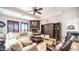 Cozy living room boasts a stone fireplace, comfortable seating, and unique rustic sliding door storage at 2330 N Channing --, Mesa, AZ 85207
