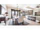Open concept living and dining room includes tile floors, stone fireplace, and stylish furniture at 2330 N Channing --, Mesa, AZ 85207