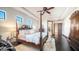 Spacious main bedroom with a four-poster bed, ample natural light, and decorative accents at 2330 N Channing --, Mesa, AZ 85207