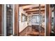 Home office with hardwood floors, wood beam ceilings, glass door entry and an executive style wood desk at 2330 N Channing --, Mesa, AZ 85207