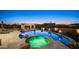An entertainer's delight featuring a luxurious pool, hot tub, pergola, and fire bowls for ambiance at 2330 N Channing --, Mesa, AZ 85207