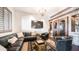 Stylish sitting room with a built-in wine storage, a comfortable leather sectional, and stone accent wall at 2330 N Channing --, Mesa, AZ 85207