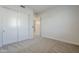 An empty bedroom with carpet, sliding door closet, and white walls ready for you to make it home at 3128 E Cheryl Dr, Phoenix, AZ 85028