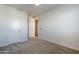 A simple bedroom with a closet and view of the door to a nearby bathroom, all in a bright setting at 3128 E Cheryl Dr, Phoenix, AZ 85028