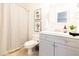 Well-lit bathroom featuring a single sink vanity, a mirror, and decorative art pieces at 3726 S Juniper St, Tempe, AZ 85282