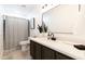 Modern bathroom featuring sleek vanity, elegant mirror, and stylish shower with designer curtain at 3726 S Juniper St, Tempe, AZ 85282