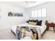 Bright bedroom with large bed, stylish decor, modern fixtures, and a cozy ambiance at 3726 S Juniper St, Tempe, AZ 85282