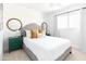 Stylish bedroom features a bed with decorative pillows, dual mirrors, and bright, natural light at 3726 S Juniper St, Tempe, AZ 85282