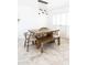 Dining room featuring a rustic table and chairs, with a stylish pendant light fixture at 3726 S Juniper St, Tempe, AZ 85282