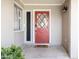Inviting front entrance featuring a red door, sidelight and a 'hello' doormat at 3726 S Juniper St, Tempe, AZ 85282