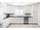 Updated kitchen featuring white cabinets, subway tile backsplash, and stainless steel appliances at 3726 S Juniper St, Tempe, AZ 85282