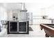 Modern kitchen island with wine coolers and a view of the well-equipped kitchen at 3726 S Juniper St, Tempe, AZ 85282
