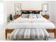 Tastefully decorated main bedroom features a bed with throw pillows, nightstands with lamps, and carpet at 3726 S Juniper St, Tempe, AZ 85282
