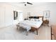 Bright main bedroom with a large bed, nightstands with lamps, and a view of the closet at 3726 S Juniper St, Tempe, AZ 85282