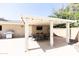 Covered patio with dining table, chairs, a mounted TV, and stainless steel grill at 3726 S Juniper St, Tempe, AZ 85282