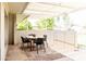 Cozy outdoor seating area with a round table, black chairs, and a lattice-covered patio at 3726 S Juniper St, Tempe, AZ 85282