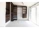 Bright walk-in closet with custom dark wood shelving and drawers, with access to patio at 3726 S Juniper St, Tempe, AZ 85282