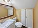 Bathroom featuring neutral walls, a large mirror, sink, and linen closet at 3732 E South Fork Dr, Phoenix, AZ 85044