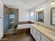 Beautiful primary bathroom with a tiled shower, soaking tub, and double vanity at 3732 E South Fork Dr, Phoenix, AZ 85044