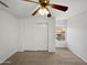 Bedroom with a large closet, window, neutral walls, carpet, and ceiling fan at 3732 E South Fork Dr, Phoenix, AZ 85044