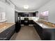 A kitchen featuring granite countertops, and black appliances at 3732 E South Fork Dr, Phoenix, AZ 85044
