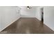 Open-concept living room with sleek tile flooring, a large window and view to kitchen at 3732 E South Fork Dr, Phoenix, AZ 85044