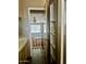 View from updated bathroom looking toward breakfast nook, wood floors, and ceiling fan at 4065 E University Dr # 271, Mesa, AZ 85205
