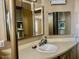 Compact bathroom with ample storage space, vanity, and medicine cabinets at 4065 E University Dr # 271, Mesa, AZ 85205