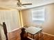 Dining area with laminate wood floors, natural light, and a simple table setup at 4065 E University Dr # 271, Mesa, AZ 85205