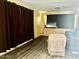 Cozy living room with dark hardwood floors, recliner and blackout curtains at 4065 E University Dr # 271, Mesa, AZ 85205