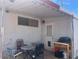 Covered outdoor patio featuring dining table and grill at 4065 E University Dr # 271, Mesa, AZ 85205