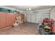 Spacious garage featuring storage cabinets and a roll-up door for two cars at 4830 S Grenoble --, Mesa, AZ 85212