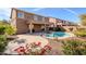 Beautiful backyard with a private pool, covered patio, and mature landscaping at 5110 W Sweet Iron Pass, Phoenix, AZ 85083