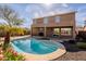 Backyard featuring a swimming pool, covered patio, and established landscaping at 5110 W Sweet Iron Pass, Phoenix, AZ 85083