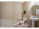 Powder bathroom featuring a pedestal sink, tile floors, and neutral color palette at 5110 W Sweet Iron Pass, Phoenix, AZ 85083