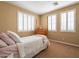 Bedroom with plantation shutters, neutral walls, and a wooden four-poster bed at 5110 W Sweet Iron Pass, Phoenix, AZ 85083