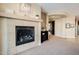 The fireplace provides a cozy and warm ambiance to the living space at 5110 W Sweet Iron Pass, Phoenix, AZ 85083